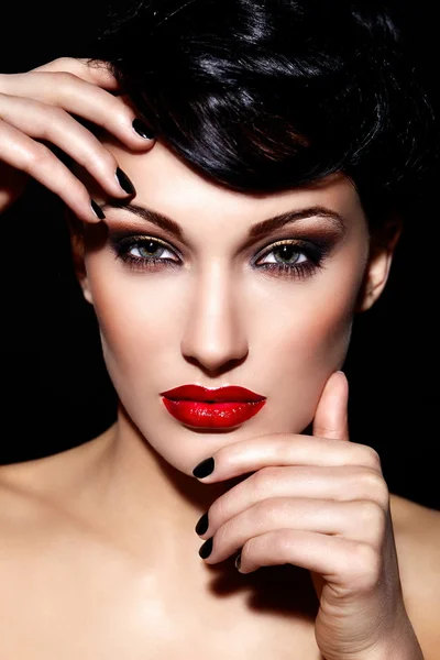 High fashion look.glamor closeup portrait of beautiful sexy brunette Caucasian young woman model with bright makeup, with red lips, with perfect clean skin Royalty Free Stock Images