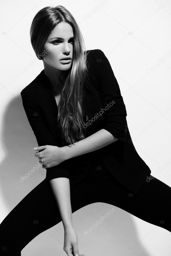 High fashion look.glamor portrait of beautiful sexy stylish Caucasian young woman model in black cloth