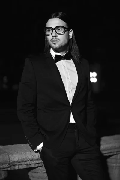 Handsome man in black costume in glasses — Stock Photo, Image