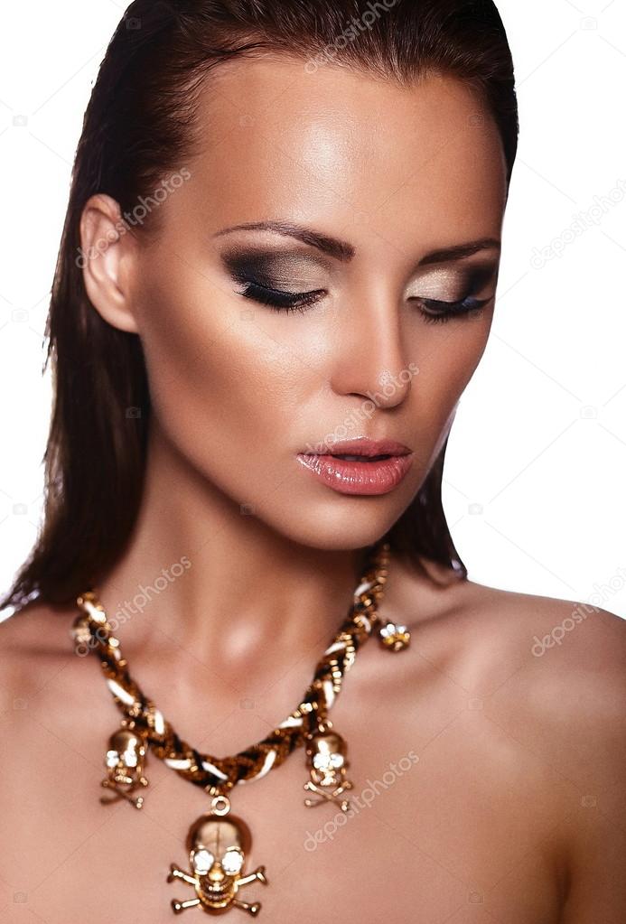Young woman model with bright makeup with jewelery