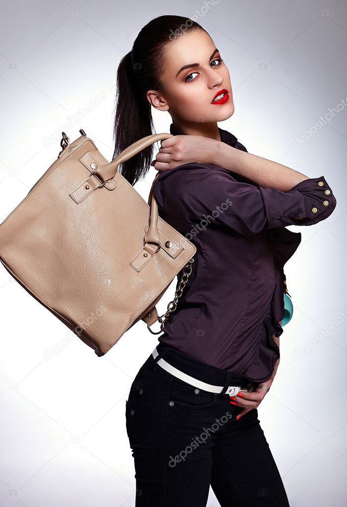 Woman model with bright makeup and bag