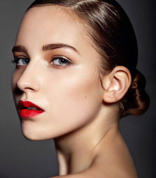 High fashion look.glamor close seup portrait of beautiful sexy stylish Caucasian young woman model with bright makeup, with red lips, with perfect clean skinkeup, with red lips, with perfect clean skin
