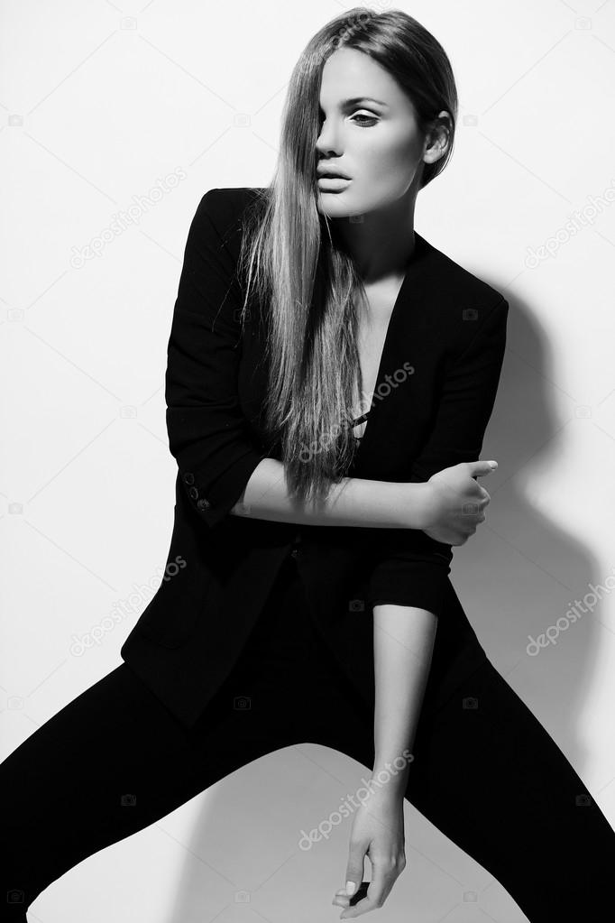 High fashion look.glamor portrait of beautiful sexy stylish Caucasian young woman model in black cloth