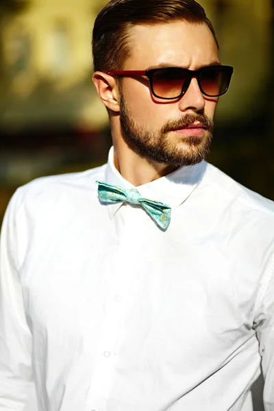 Young stylish sexy handsome model man in casual cloth lifestyle in the street in glasses — Stock Photo, Image