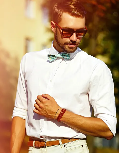 Young stylish sexy handsome model man in casual cloth lifestyle in the street in glasses — Stock Photo, Image