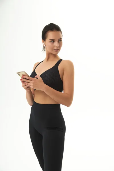 Fitness Girl Training Sportswear Holds Smart Phone Her Hands — Stock Photo, Image