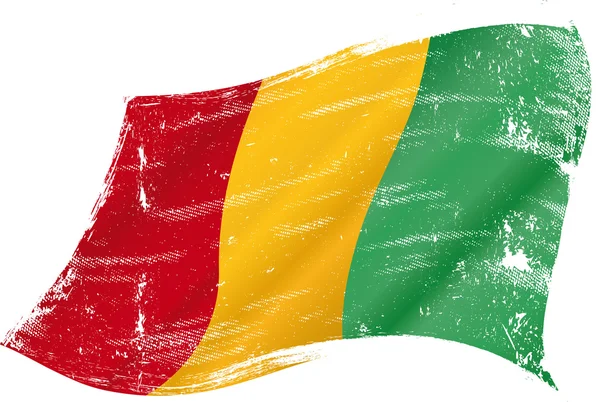 Waving Guinean grunge flag — Stock Vector