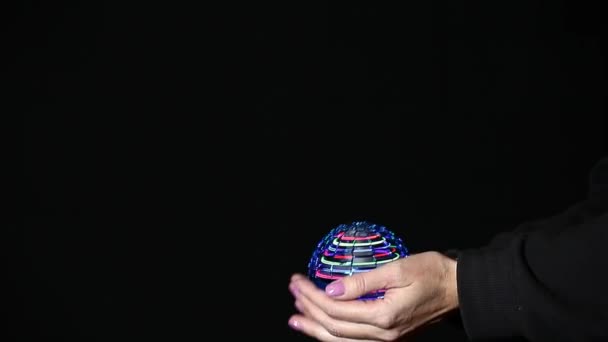Footage Spinner Hand Dark Background — Stock Video