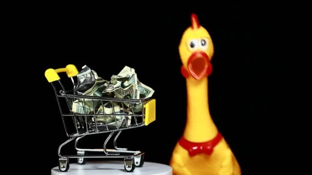 Footage Trolley Money Toy Chicken Dark Background — стоковое видео