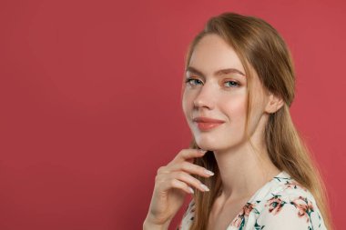 Happy cheerful young woman with charming smile and healthy skin. Ginger student model portrait