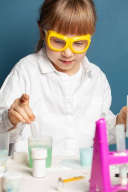 Portrait of little child girl student scientist