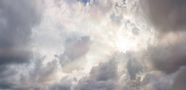 Sunshine and cloudy sky. Dramatic storm gray clouds on sky