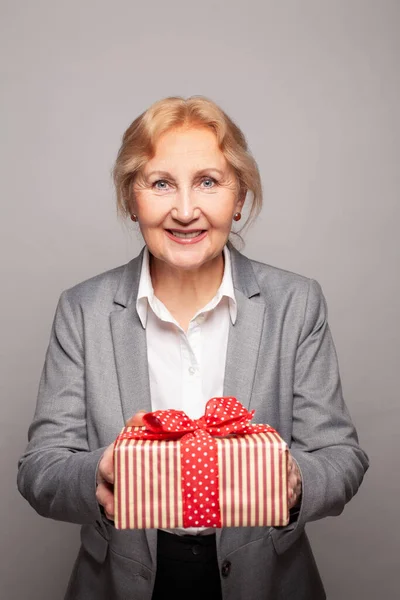 Senior Woman Red Gift Gray Studio Background — Stock Photo, Image