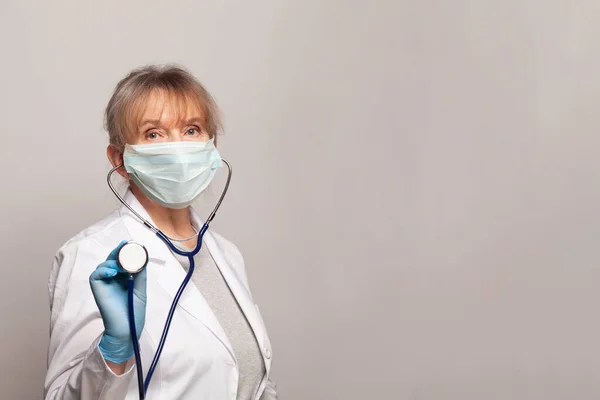 Happy Mature Doctor White Uniform Standing Stethoscope Grey Background — Stock Photo, Image