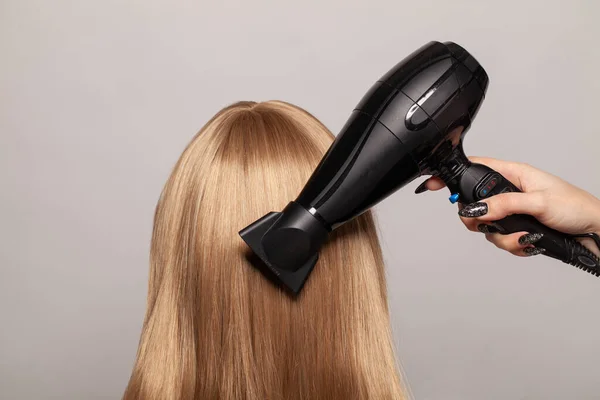 Long Smooth Shiny Healthy Hair Hair Dryer Gray Studio Wall — Stock Photo, Image