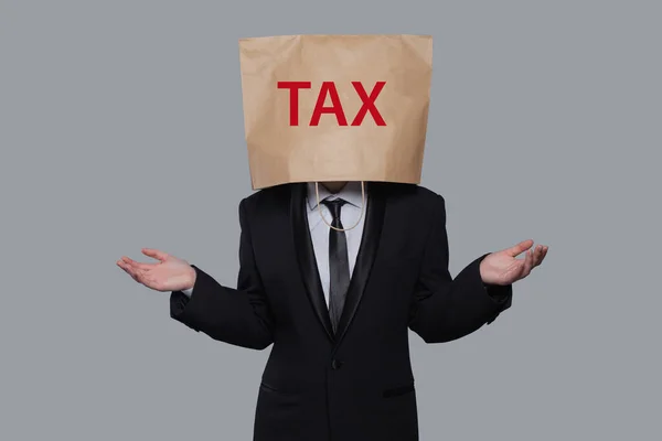 彼の頭の上に紙袋で事業家を失望させた 租税概念 — ストック写真