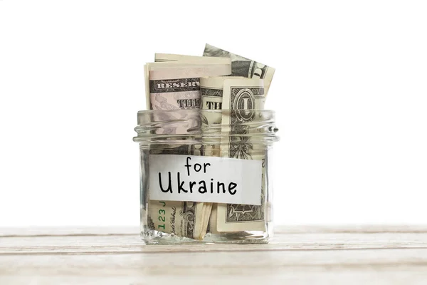 ガラス瓶の米ドル紙幣ウクライナのための碑文 — ストック写真