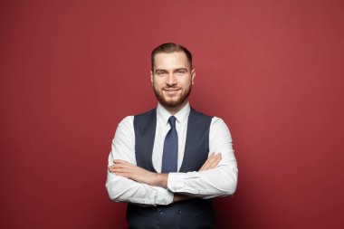 QPortrait of a serious handsome businessman in office