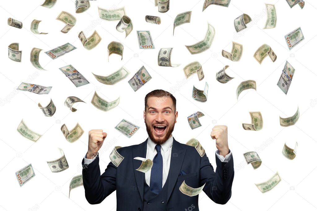 Smart happy successful young businessman having fun in falling 100 dollar cash money isolated on white