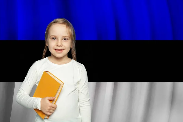 Child Girl Holding Taxtbook Standing Estonian Flag Background School Estonia — Stock Photo, Image