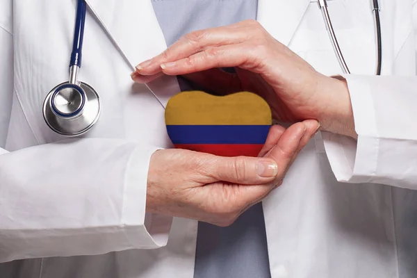 Colombian Doctor Holding Heart Flag Republic Colombia Background Healthcare Charity — Stock Photo, Image