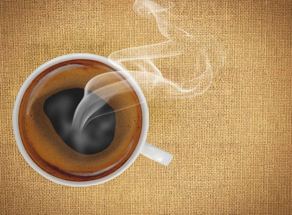 Cup of coffee on flax texture — Stock Photo, Image