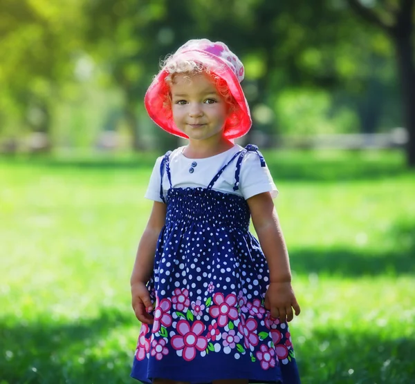 Cute little girl in summer park — Stock Photo, Image