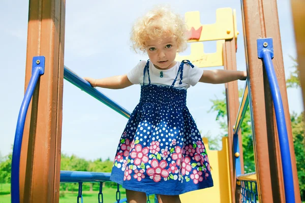 Cute little girl at playground — Stock Photo, Image