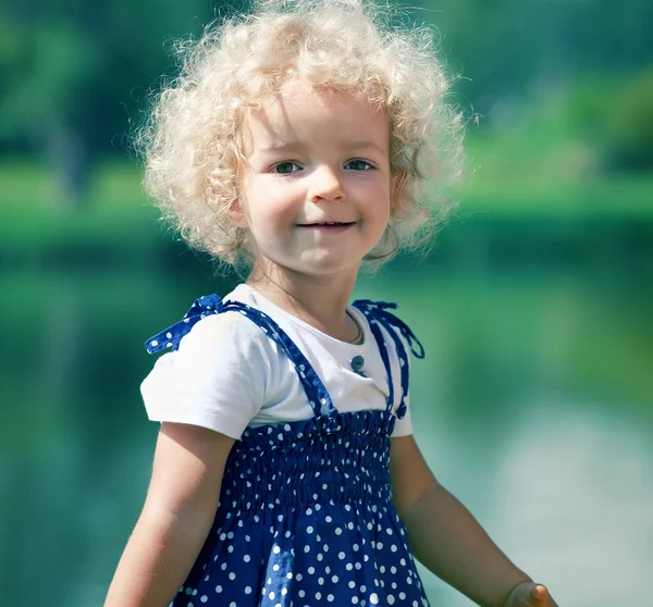 Cute little girl in summer park — Stock Photo, Image