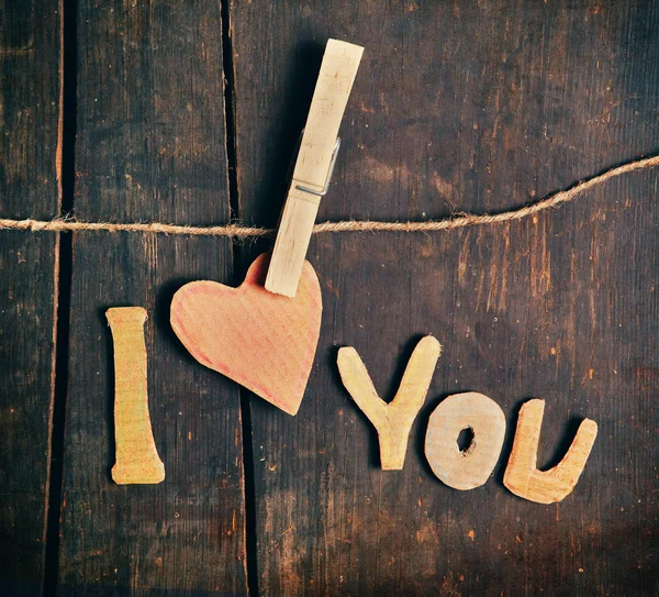 Paper words I love you on wooden board — Stock Photo, Image