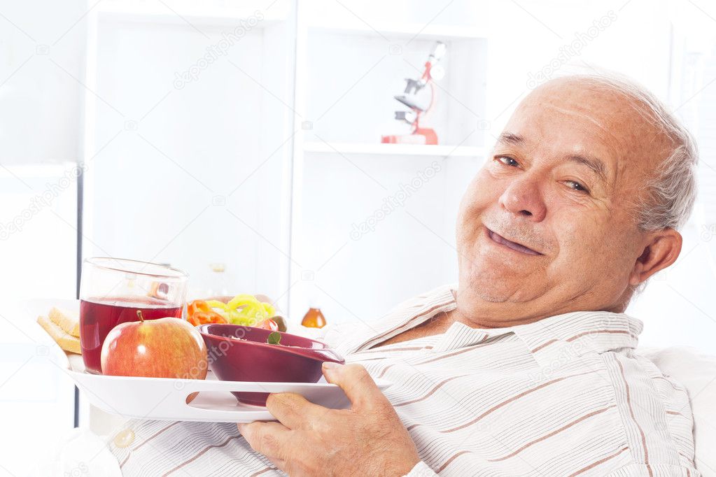 Elderly man in the hospital bed