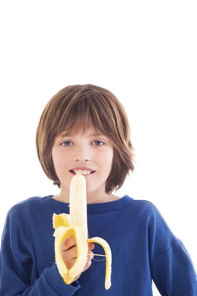 소년 먹는 바나나 스톡 사진