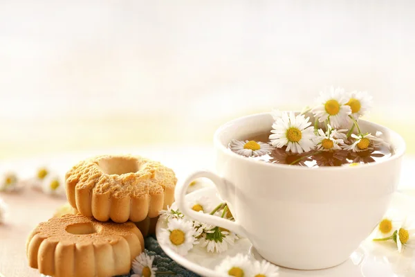 Chamomile tea with biscuits — Stock Photo, Image