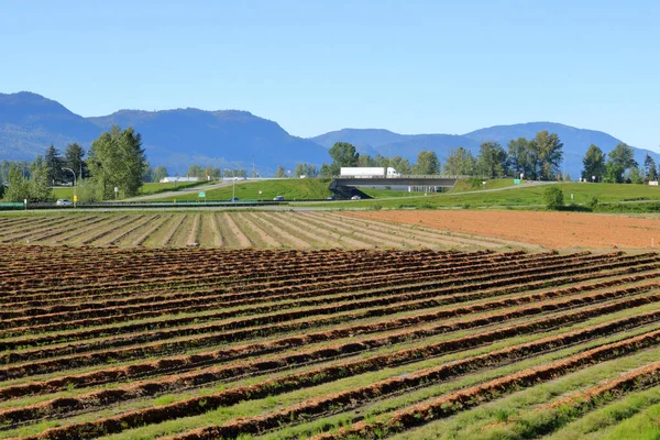 Wide View Planted Farm Field Busy Highway Valley — Fotografia de Stock