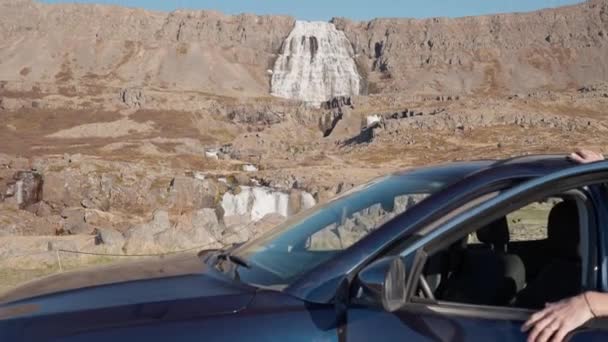 Dolly Shot Over Car Towards Waterfall On Mountain — Stock video