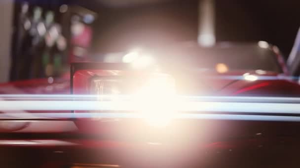 Glowing Headlight Of Red Ferrari 348 TB Parked In Gas Station — Stock Video