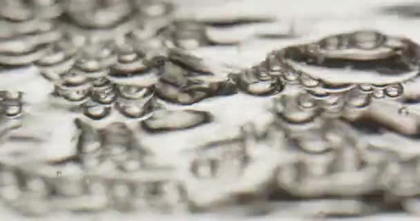 Bubbles Rising To A Moving Surface Of Water — Video Stock