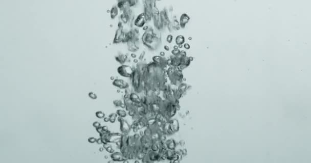 Bubbles Forming As Liquid Is Poured Into Water — Wideo stockowe