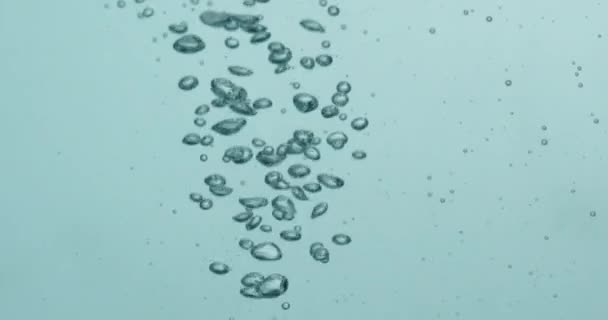 Liquid Being Poured Into Water Creating Rising Bubbles — Vídeo de Stock