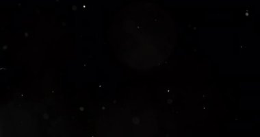 Siyah arkaplana karşı suda parçacıklar ve kabarcıklar