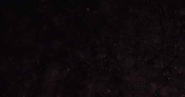 Kırmızı Parçacıklar ve Sudaki Baloncuklar Siyah Arkaplan Karşısında