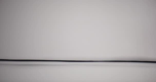 Water Surface Moving Up And Down Against White Background — Video Stock