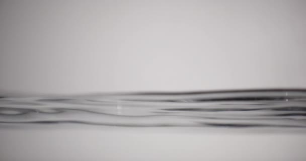 Water Surface In Motion Against White Background — Stockvideo