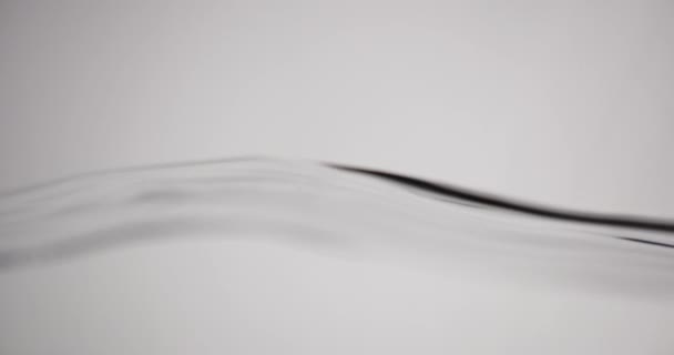 Water Surface In Motion Against White Background — Stockvideo