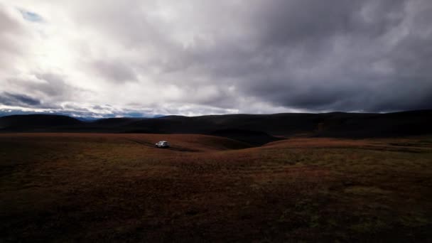 Drone Tracking Truck In Dark Mountain Landscape — Stockvideo
