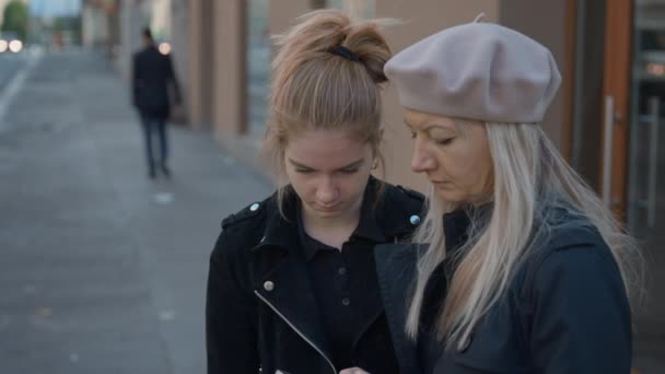 Mother Looking For Directions On Smartphone With Daughter In Prague — Wideo stockowe
