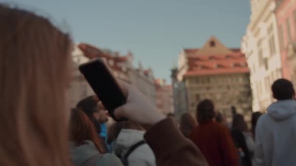 Young Woman Filming With Smartphone In Town Square Of Prague — 图库视频影像