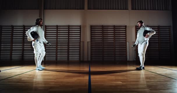 Duelling Fencers In School Gym Kissing Swords Before Fighting — Stok Video