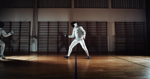 Fencers Thrusting And Parrying At Each Other With Their Foils — Stockvideo