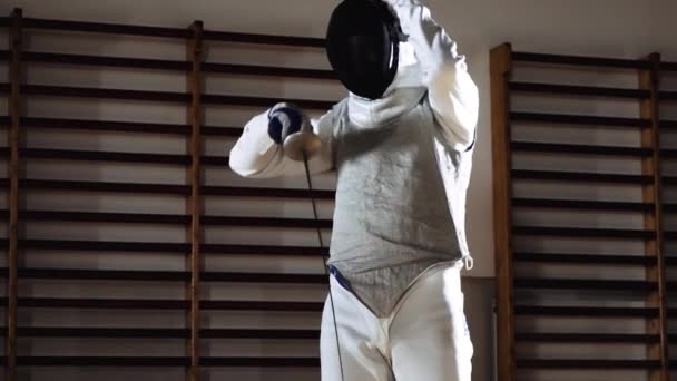 Man Putting On Fencing Mask To Duel With Foil — 图库视频影像